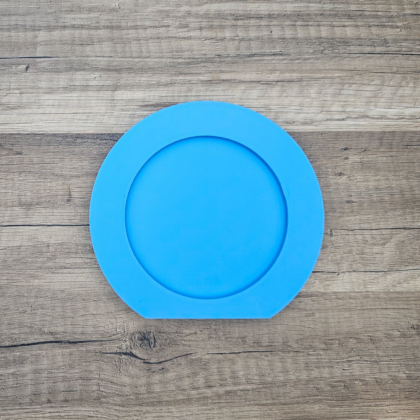 One blue picture frame that hold interchangeable ears